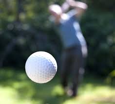 GOLF BALL FLYING TOWARD CAMERA SCREEN